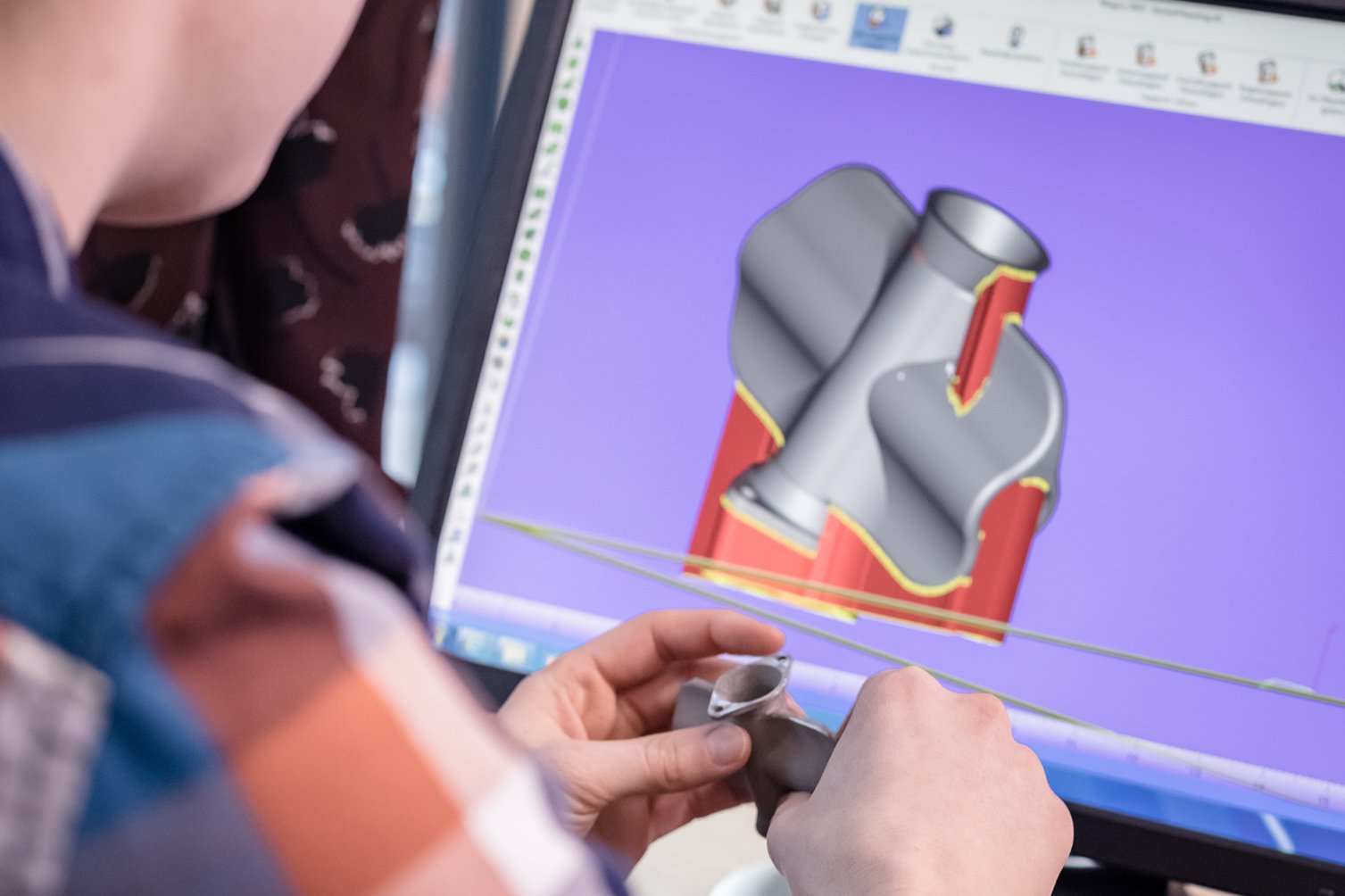 3D model of a part in a screen.