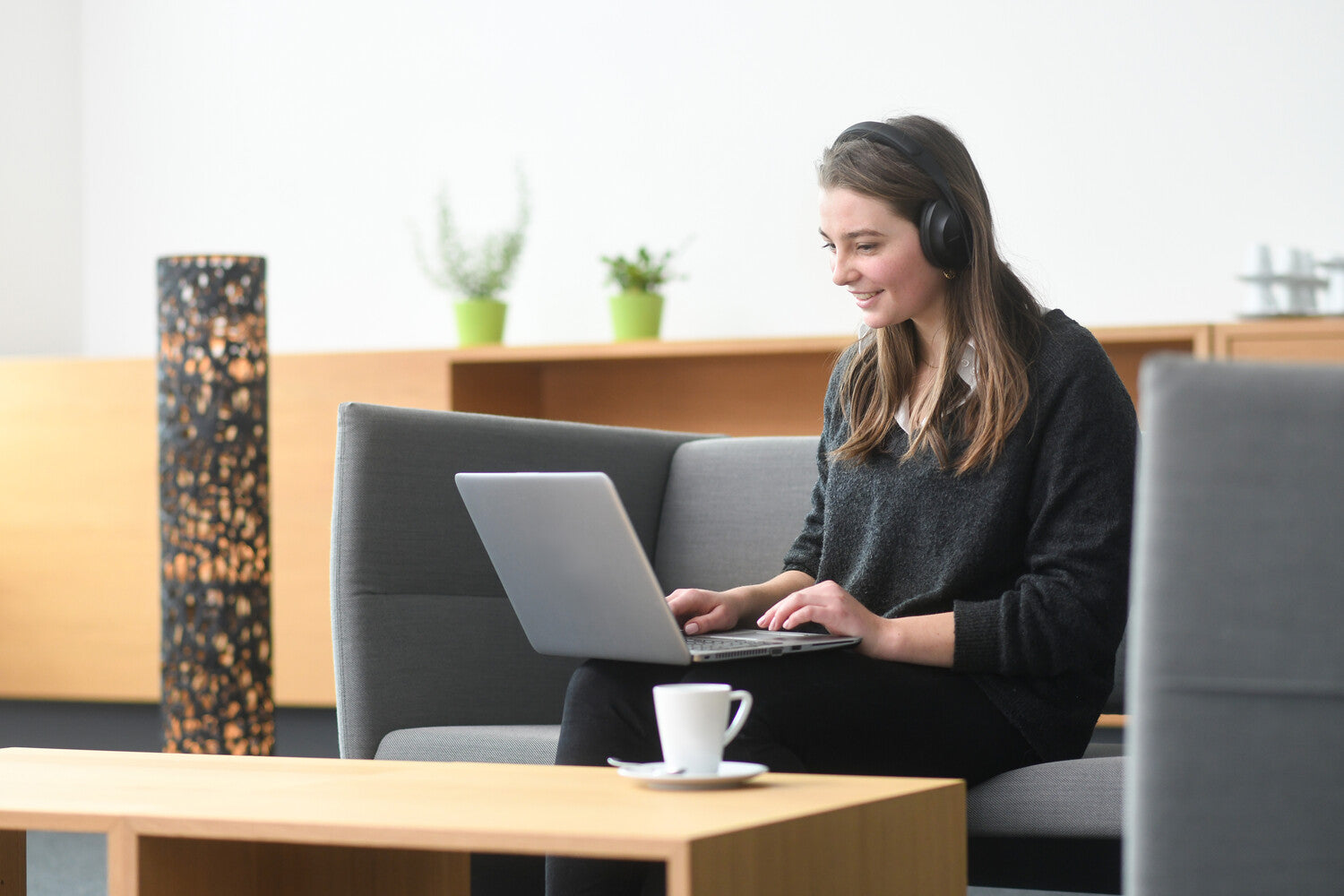 Woman working on a laptop.